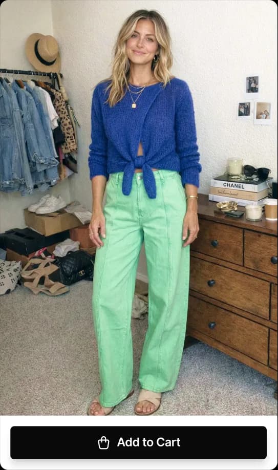 Finished virtual try-on showing the selected blue sweater and green pants.